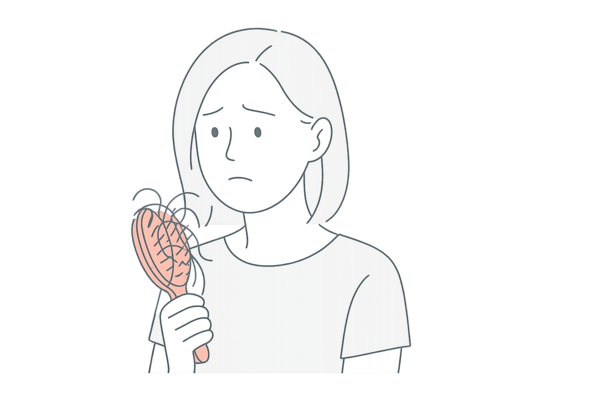抜け毛の急増に気づく女性