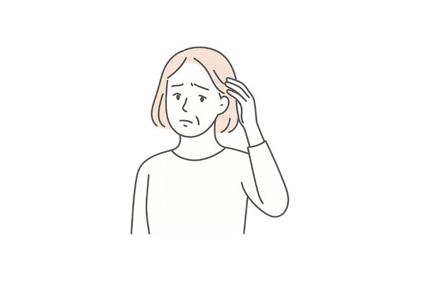 女性が頭髪に悩んでいる様子