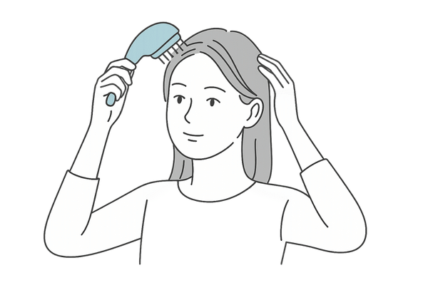 女性が家庭用スカルプデバイスを使って頭皮ケアをしているイラスト